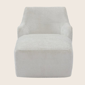 Modern armchair with simplistic design, light fabric upholstery, square form.