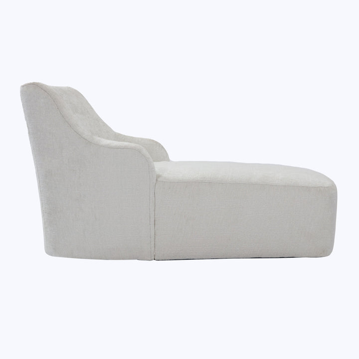Minimalist chaise lounge in light beige upholstery, modern design aesthetic.