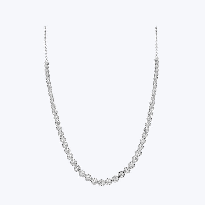 Elegant tennis necklace with round-cut diamonds on plain background.