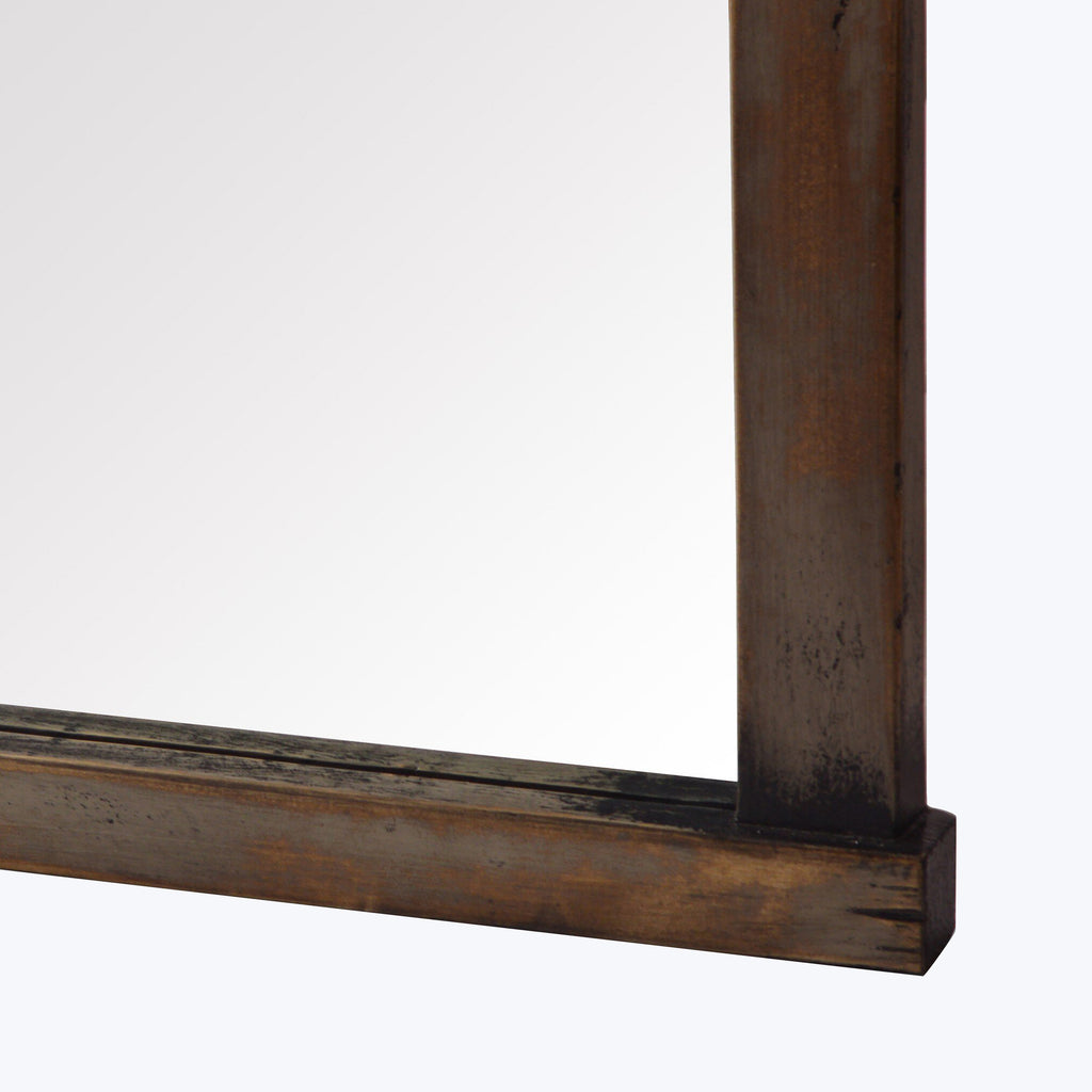 Close-up of aged wooden frame with dark brown finish design.