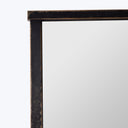 Aged black picture frame corner with white interior detail.