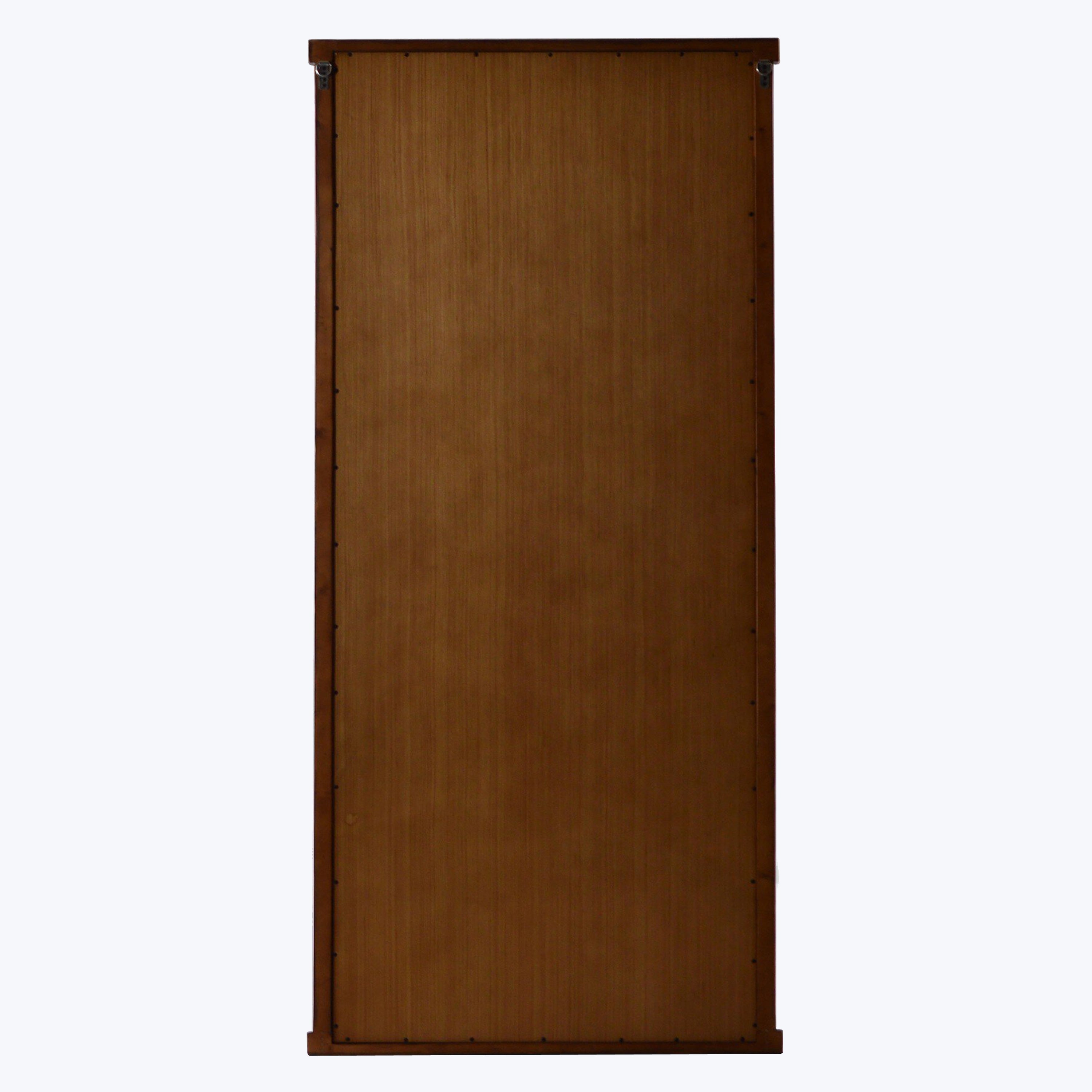 Tall wooden door with subtle gradient, visible hinges, isolated on white.