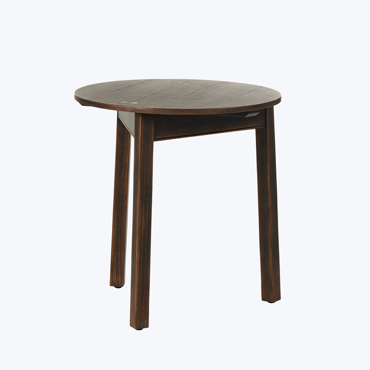 Traditional round wooden table on white background, dark brown color.