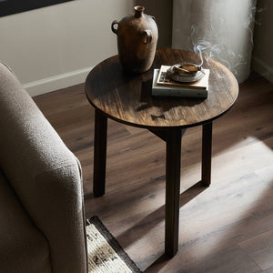 Dark stained round wooden table with textured finish and straight legs - hover
