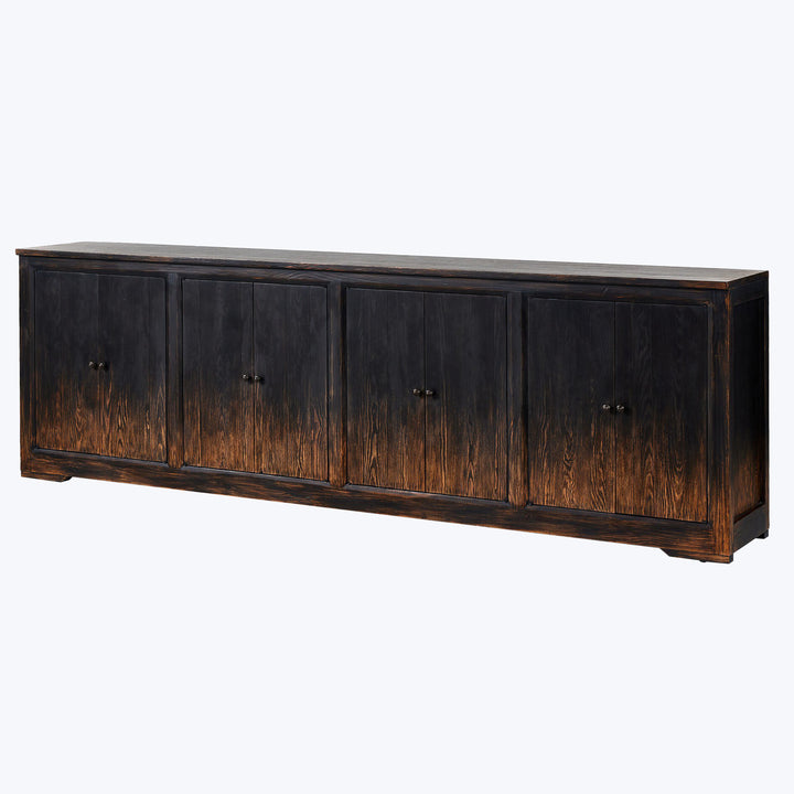 Distressed dark wood sideboard with four doors and round knobs.