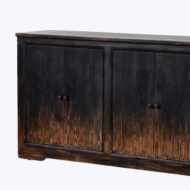 Rustic wooden sideboard with dark finish and metal pull knobs.