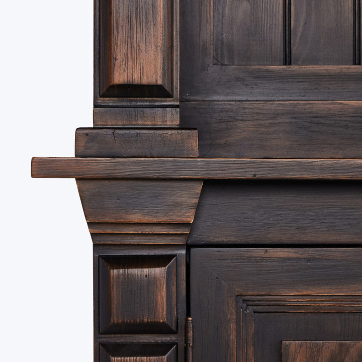 Close-up of high-quality dark-stained wooden furniture piece, intricate design.