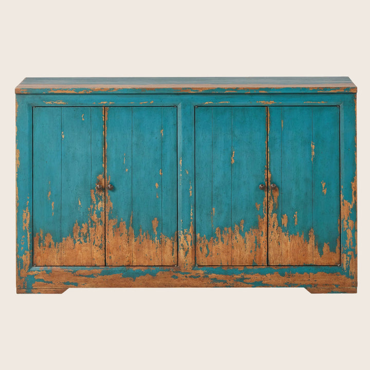 Distressed turquoise blue wooden sideboard with vintage aesthetic and handles.