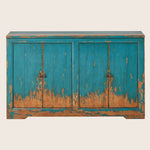 Distressed turquoise blue wooden sideboard with vintage aesthetic and handles.
