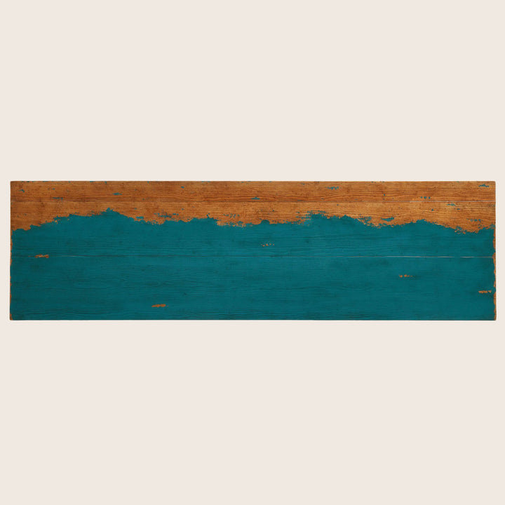 Turquoise painted wood plank with weathered natural wood bottom half.