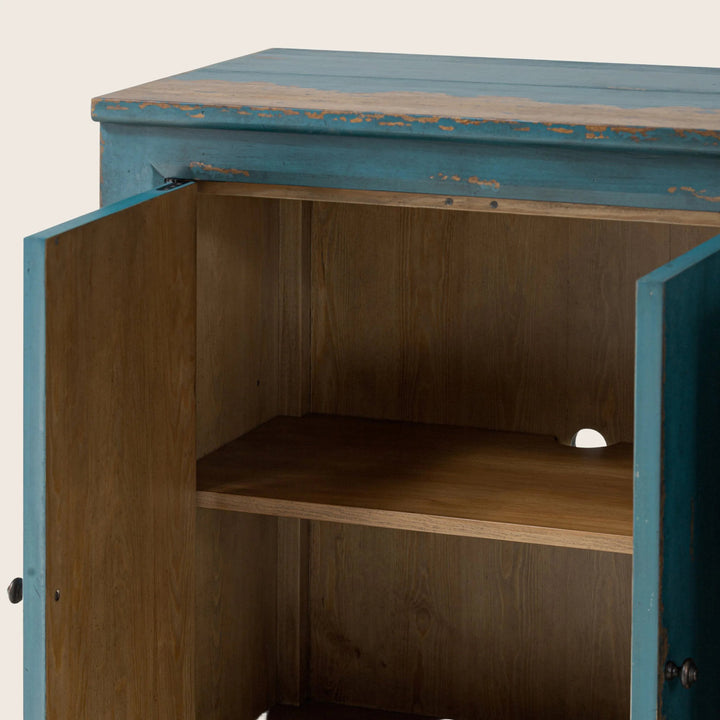 Rustic wooden cabinet with weathered blue paint and simple hardware.