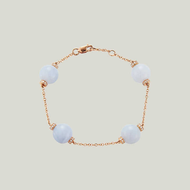 Elegant pale blue bead bracelet with glittery accents, rose gold.