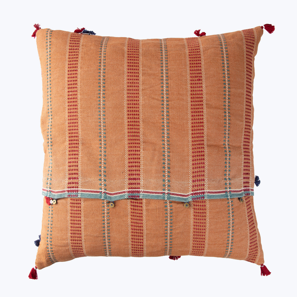 Decorative throw pillow with warm orange and blue stripes pattern