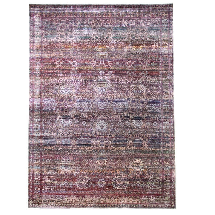 Vintage distressed ornate rug with intricate Persian-inspired design in rich colors.