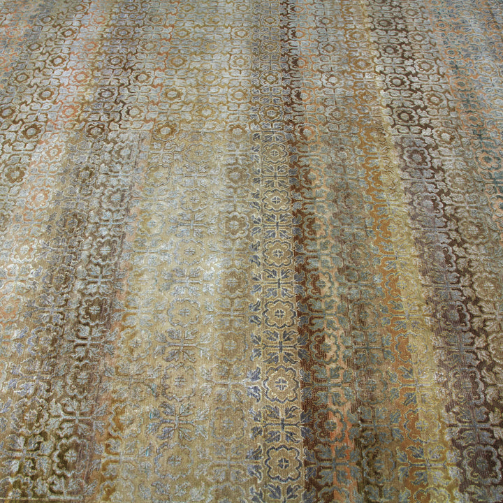 Intricate traditional carpet with geometric and floral motifs in earthy tones.