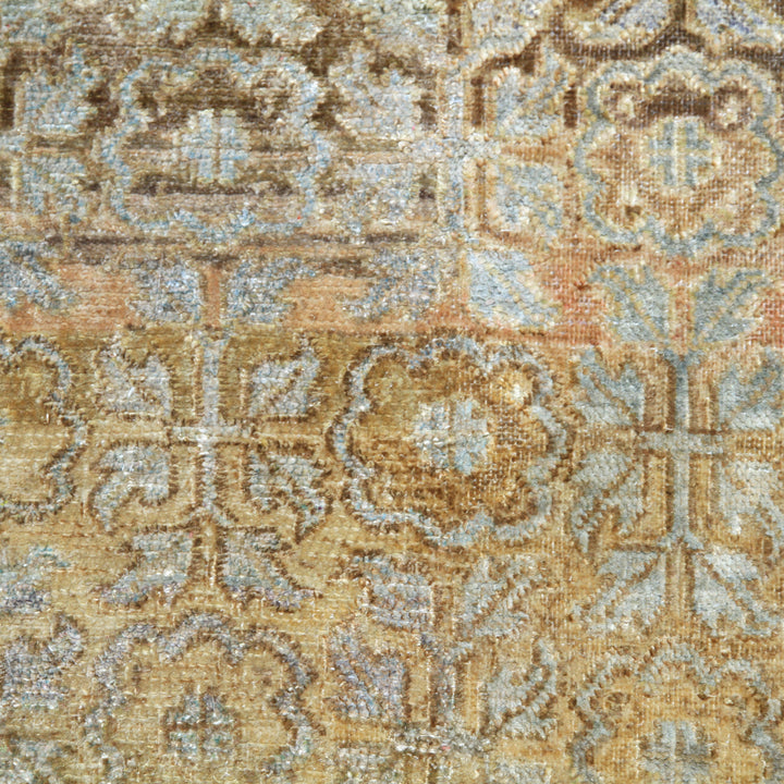 Close-up of ornate, symmetrical vintage textile in beige and brown.