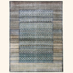 Vintage rectangular area rug with complex blue, beige, gray pattern.