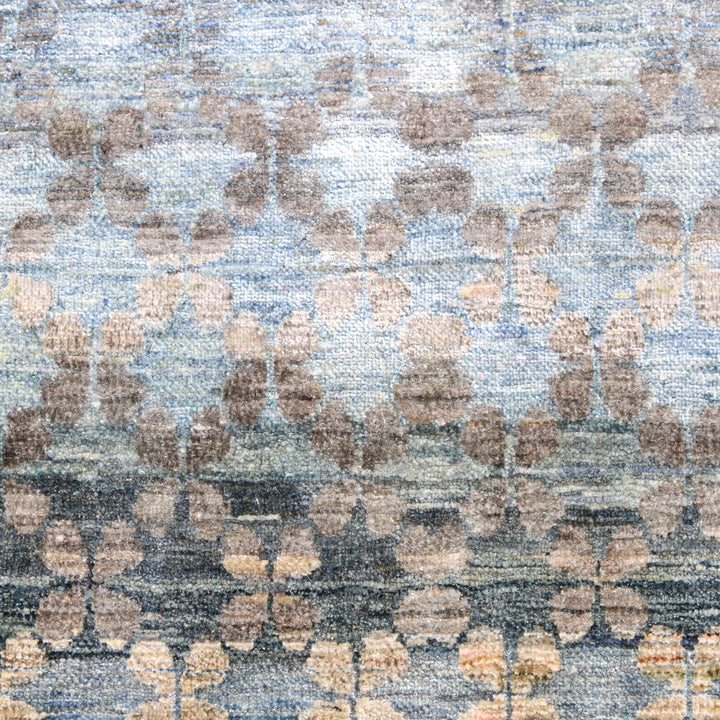 Close-up of textured fabric with repeating abstract dot pattern.