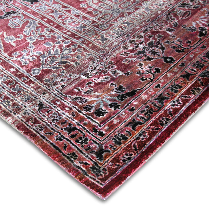 Close-up of ornate traditional rug with intricate patterns and colors.