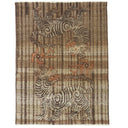 Decorative textile with stylized dragon figures on striped background design.