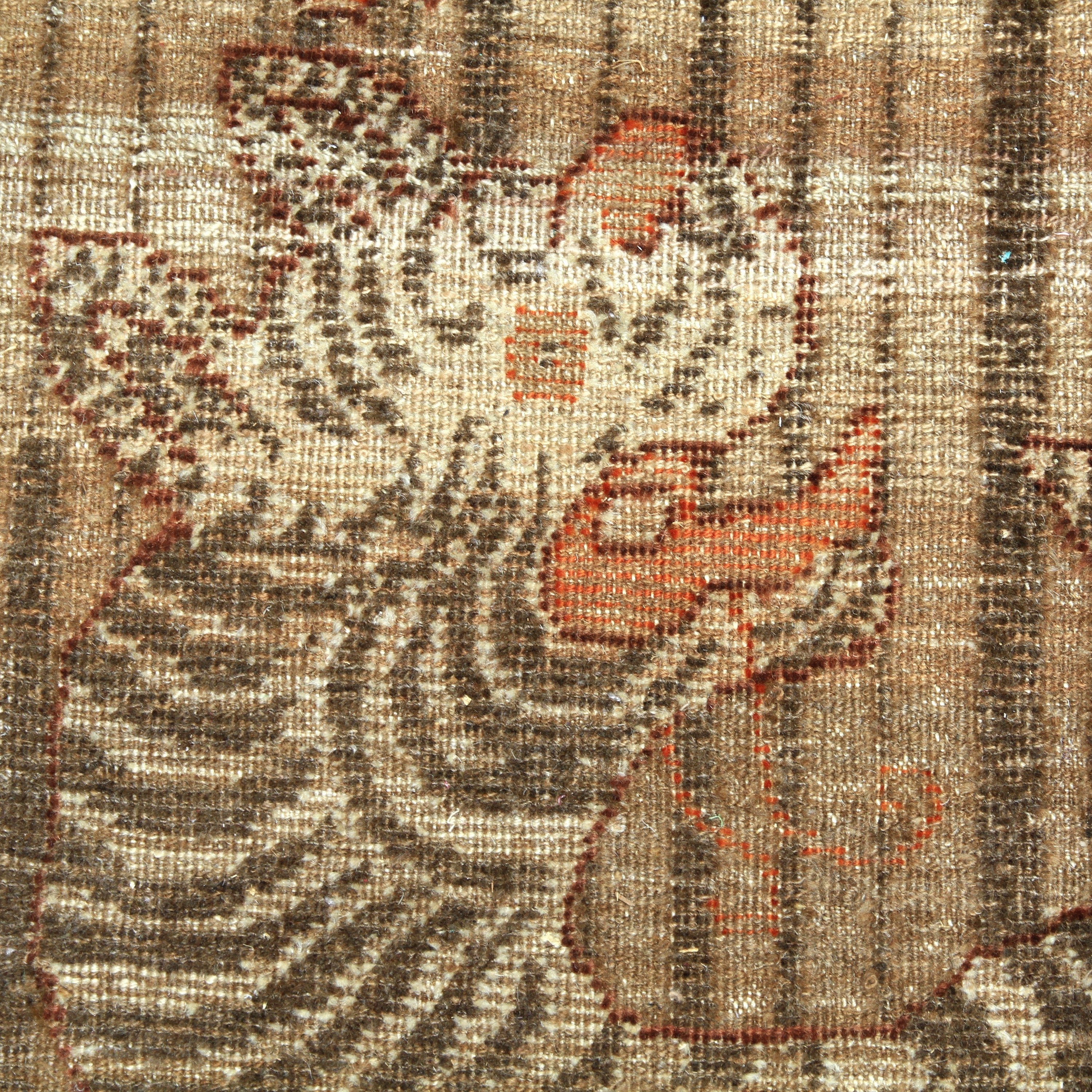 Vintage textile with woven tabby cat design in warm hues.