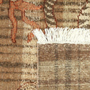 Intricate brown tapestry with red and beige details and fringe.