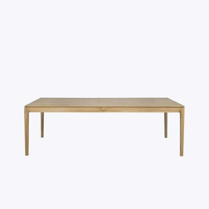 Rectangular wooden table with natural finish against neutral background, simple design