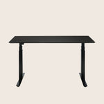Modern standing desk with adjustable height legs and sleek design.