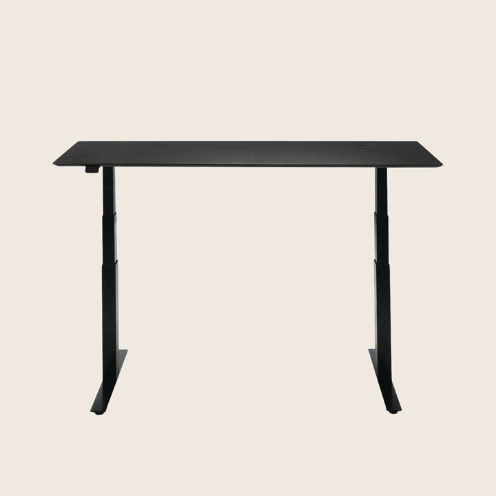 Height-adjustable standing desk with sleek modern design for ergonomic benefits.