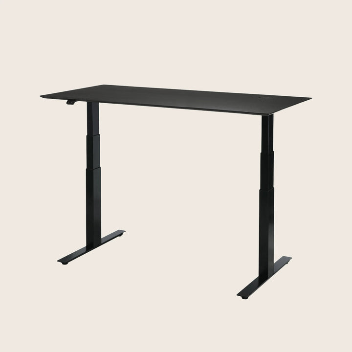 Modern height-adjustable desk with sleek black finish and minimalist design.