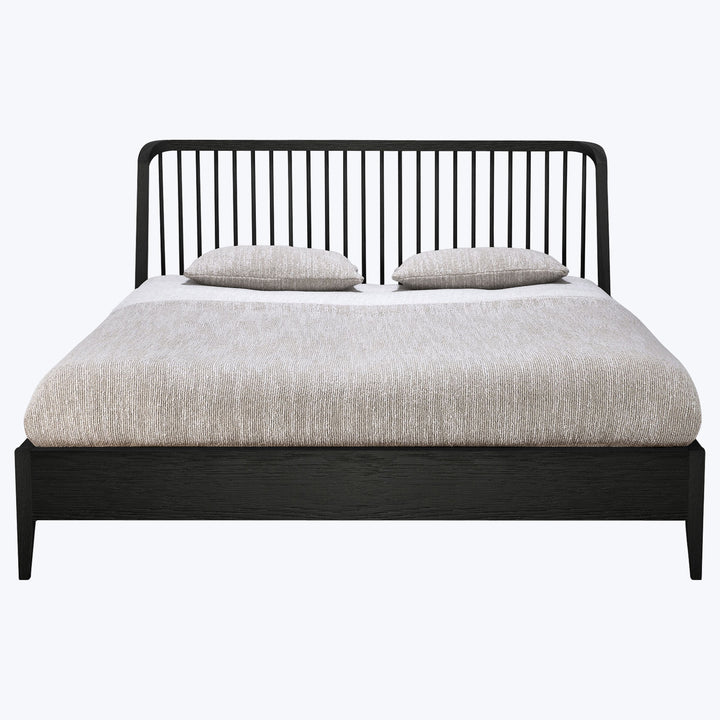 Modern black bed frame with simple headboard design, minimalist aesthetic.
