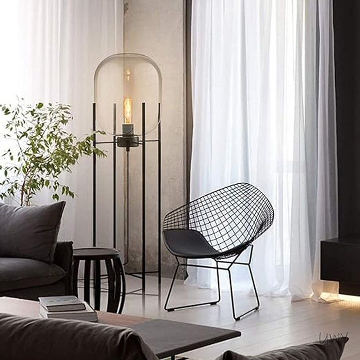 Stylish interior with modern design aesthetic featuring wire-frame chair.