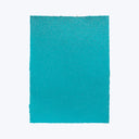 Vibrant turquoise textured rectangle with sparkling glittery surface on white.