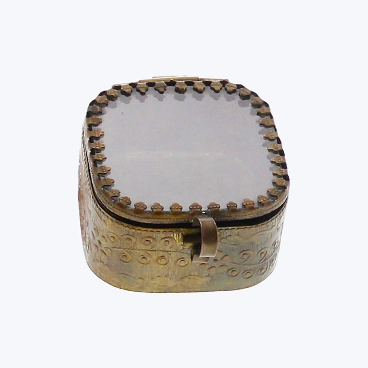 Small ornamental metal box with domed lid and embossed pattern
