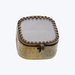 Small ornamental metal box with domed lid and embossed pattern