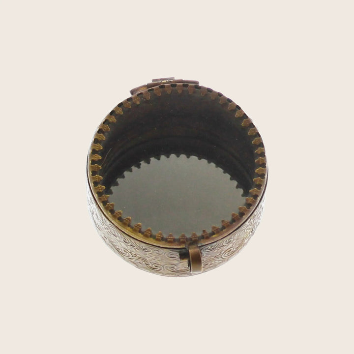 Ornate metal decorative box with hinged lid and embossed patterns.