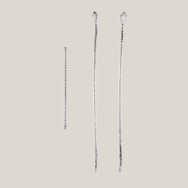 Three silver-tone jewelry chains of varying lengths on display.