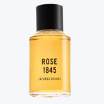 Luxurious minimalist fragrance bottle with ROSE 1845 label design.