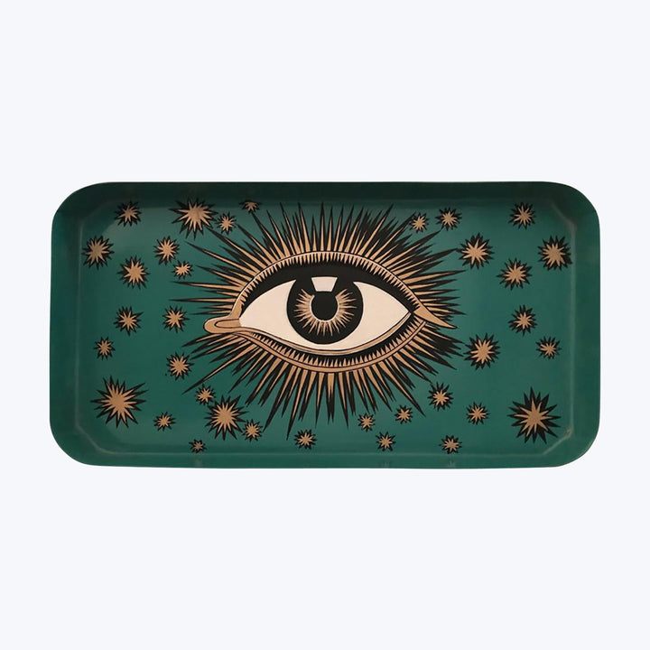Golden eye illustration on teal tray with starburst patterns background.
