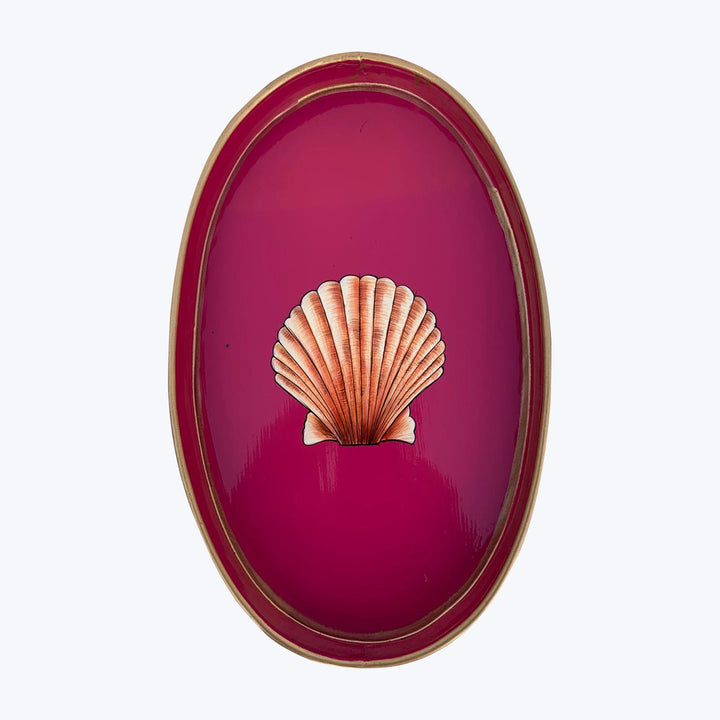 Oval object with scallop shell design on glossy red background
