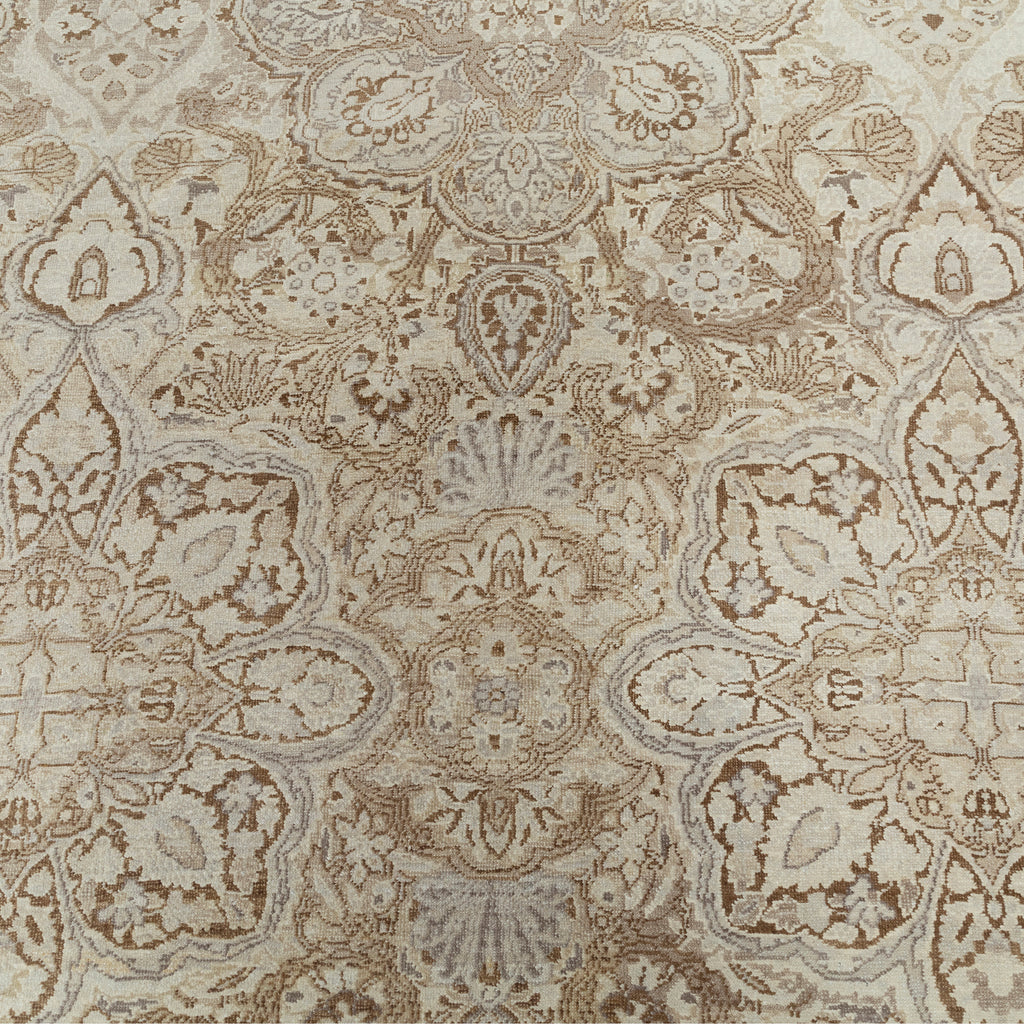 Intricate symmetrical patterned carpet in neutral tones with floral motifs