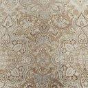 Intricate symmetrical patterned carpet in neutral tones with floral motifs