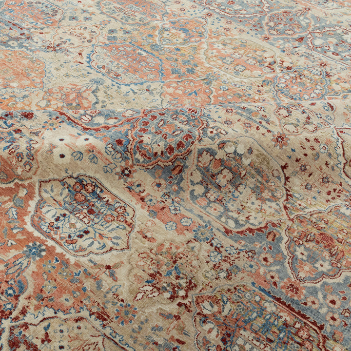 Intricately designed traditional carpet with elaborate floral and geometric patterns.