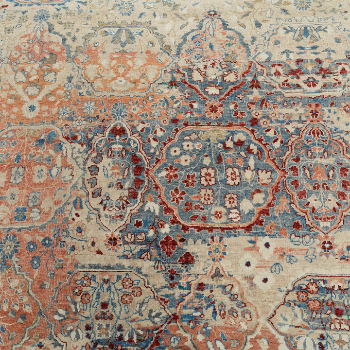 Hand-woven Persian rug with intricate floral and geometric patterns.