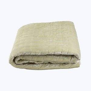 Folded yellow quilt showcases soft, textured design with plush stitched patterns. - hover