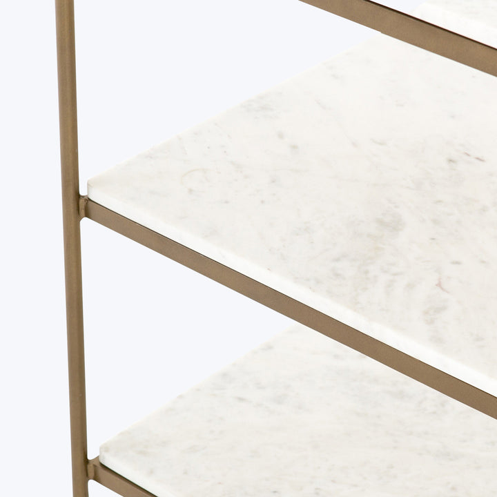 Luxurious modern shelving unit with metallic frame and marble shelves.