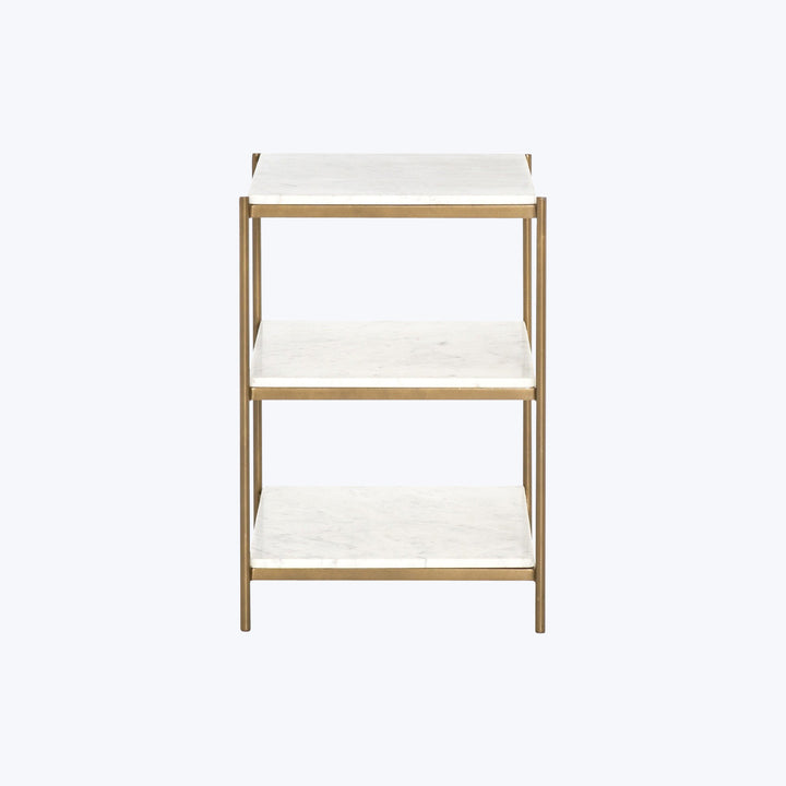 Modern gold metal shelving unit with marble-patterned cream shelves.