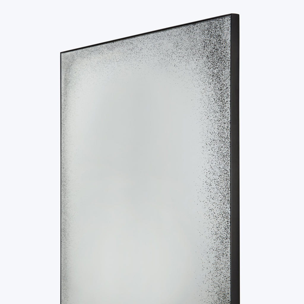 Frosted glass panel with black frame and gradient of dots.