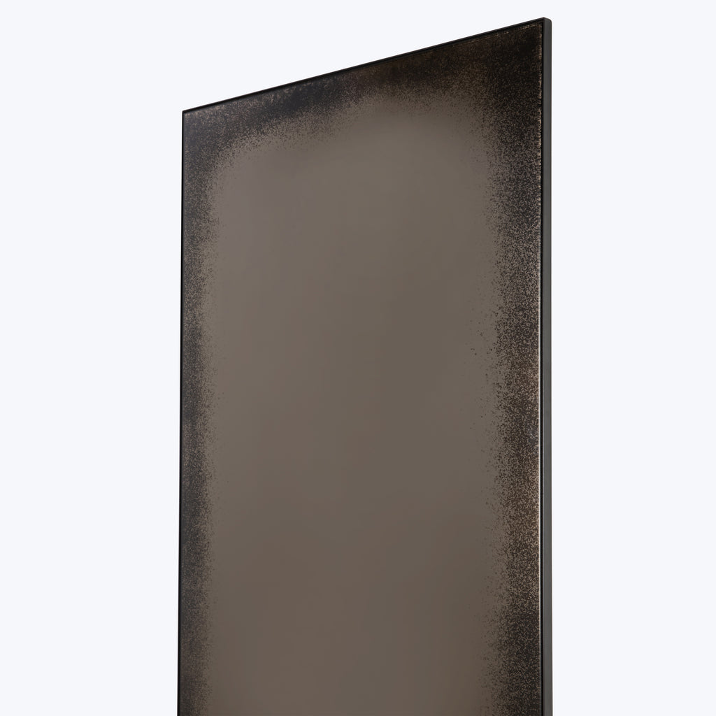 Rectangular wall decor with textured border and reflective center design.