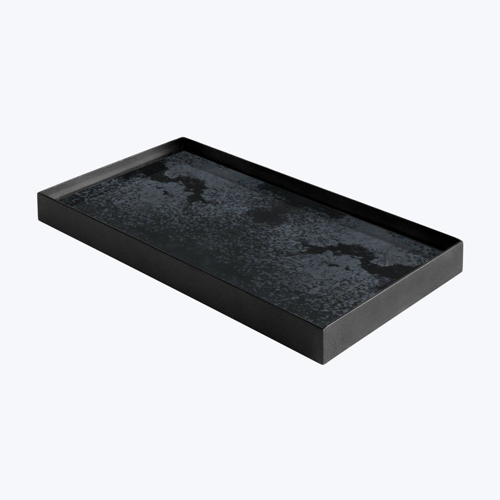 Black tray with reflective texture against gray background, decorative use.